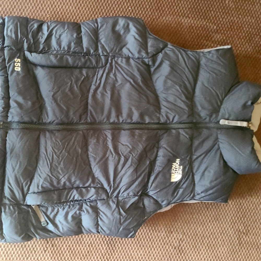 North Face vest. Black. Down filled. Medium. Food condition.